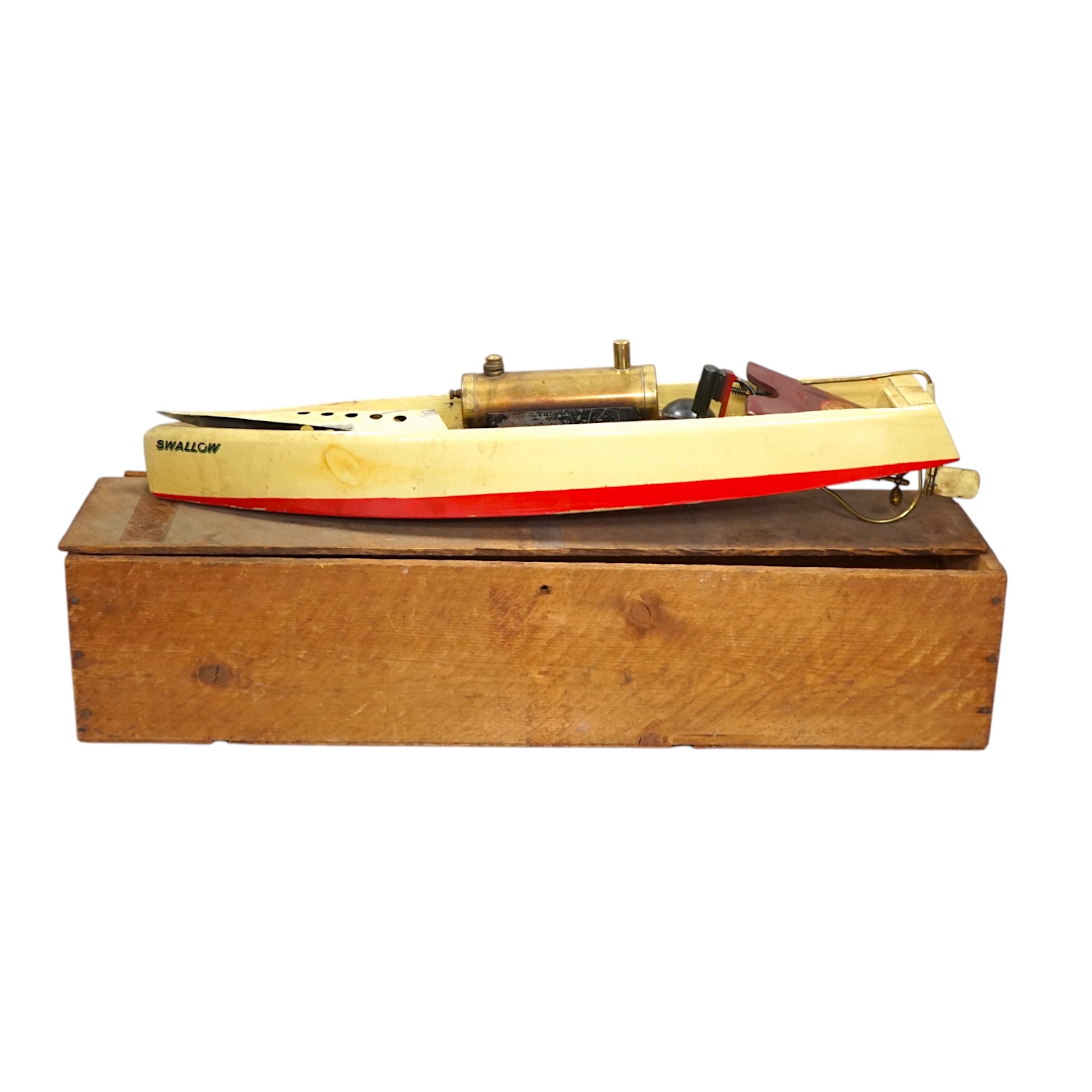 A 1930s wooden boxed Bowman Models live steam speedboat; ‘Swallow’, of wood and tinplate construction, hull 49cm long. Condition - fair.